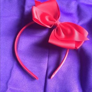 Christmas red hair band with adjustable bow.